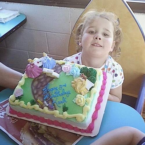 Karli as a youngster with her birthday cake.