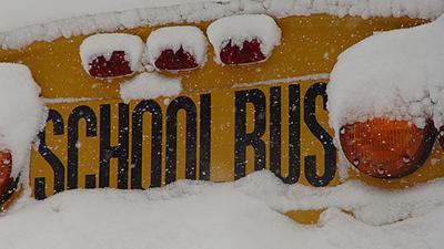school bus covered in snow