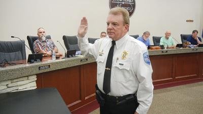 Don Moore is sworn in as the Pevely Police Department’s new captain during Monday’s Board of Aldermen meeting.