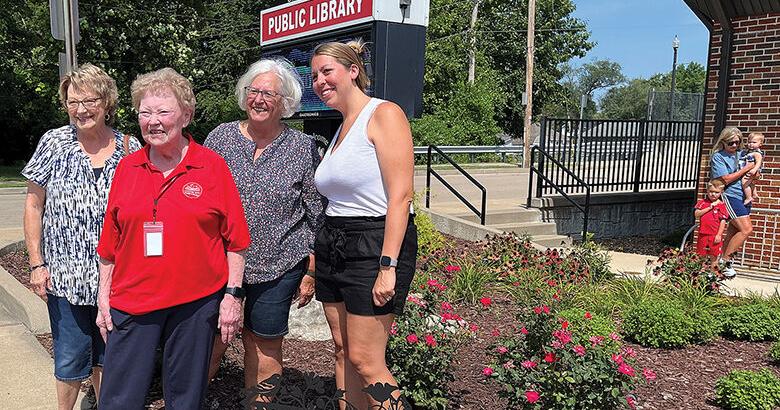 Marilyn Parr, second from left, in the garden that was named for her during a July 30 ceremony at the Crystal City Public Library. Also shown are library board members, from left, Marsha Anderson, Kathy DeGeare and Ashley Siedler.