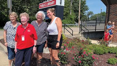 Marilyn Parr, second from left, in the garden that was named for her during a July 30 ceremony at the Crystal City Public Library. Also shown are library board members, from left, Marsha Anderson, Kathy DeGeare and Ashley Siedler.