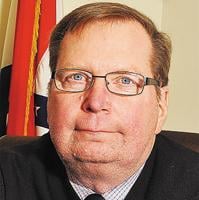 Arnold buys land to avoid trial