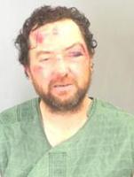 Pigg charged with shooting pizza delivery man; mobile home loaded with homemade explosive devices