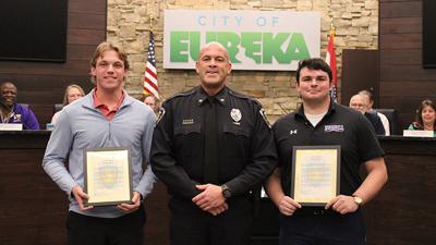 Chief Michael Werges presented civilian letters of recognition to Eureka High students Jacob Yallaly, left, and Sam Heacox on Jan. 6.