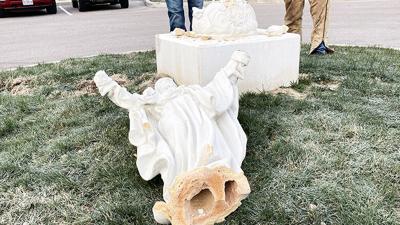 A statue of Jesus outside St. Joseph Catholic School in Imperial was knocked over and broken.