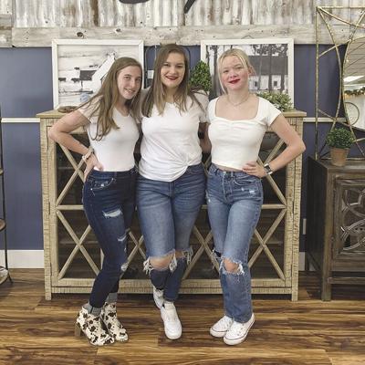 Farmhouse Style Boutique staffers, from left, Haley McElligott, Abbey Partney and Grace Gentry.