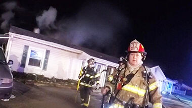 Firefighters at Schaefer Mortuary Service southwest of Arnold, where a cremation oven started a fire.