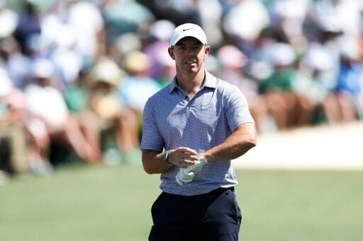 Defending champion Rory McIlroy scrambled to stay in the lead during the third round of the 90th Masters