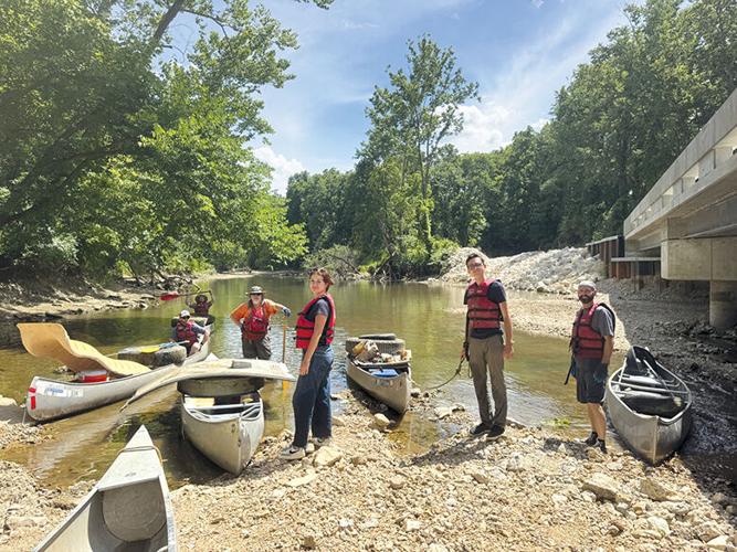 With canoes filled with trash, the cleanup crew prepared to leave Plattin Creek. From left are Pat Clemins, Tim Oberkirsch, Brian Waldrop, Leader interns Audrey Ellis and Cole Bailey, and Mike Griewing.