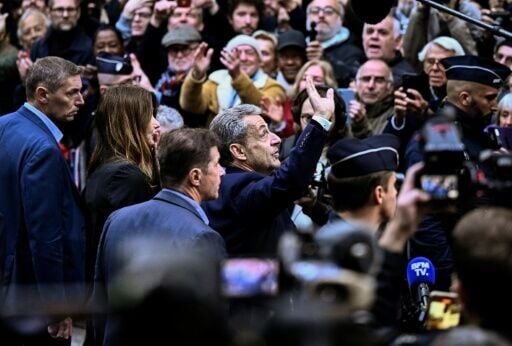 A large crowd of supporters saw Sarkozy off to jail
