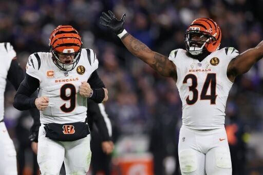 Joe Burrow and Samaje Perine of the Cincinnati Bengals celebrate a touchdown in an NFL victory over the Baltimore Ravens