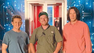 Tyler Hohmann, center, with actors Alex Winter and Keanu Reeves on the set of the 2020 film “Bill & Ted Face the Music.”