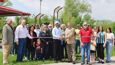 Kimmswick Mayor Kenneth Kraft and Jefferson County Councilman Charles Groeteke cut the ribbon, welcoming the public to Kimmswick Park’s new playground and pavilion.