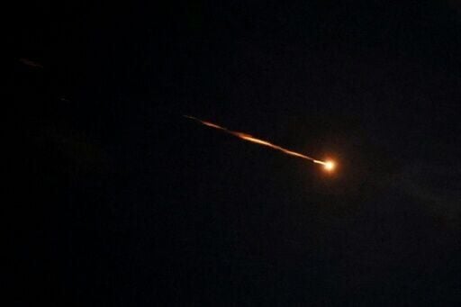 Rocket trails are seen in the sky above the Israeli coastal city of Netanya amid a fresh barrage of Iranian missile attacks