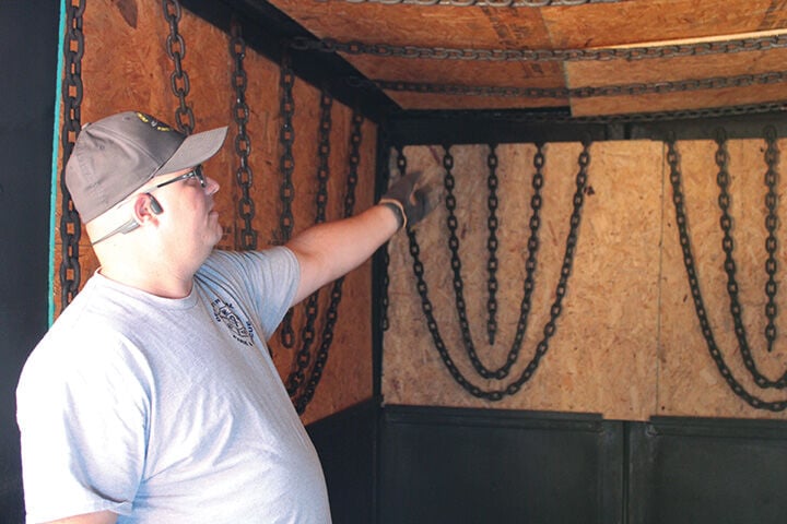 Training Officer Rob Fitzgerald explains how plywood is used during training days.