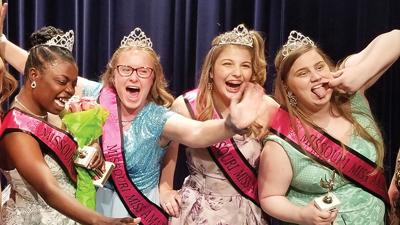 Leah Beilman, second from the left, celebrates with the three other contestants, each the winner of a different age group, at the Missouri Miss Amazing Pageant.