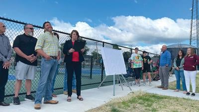 City Manager Todd Melkus reacts as Mayor Autumn Blanchard finishes reading a proclamation, naming the park with six new pickleball courts “Melkus Park.”