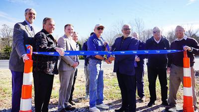 Wildwood, Missouri Department of Transportation and state officials prepare to cut the ribbon Nov. 17 to celebrate the completion of a resurfacing and J-turn project along Hwy. 100.