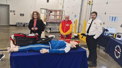 From left, Laura and Ronald Lauders and Corey Golec, Rock Township Ambulance District division chief of training, talk about a training mannequin during an Oct. 29 open house for Rock Township and the Jefferson County Sheriff’s Office shared facility at...