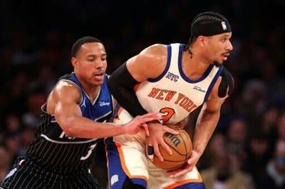 Orlando's Desmond Bane, at left guarding New York's Josh Hart, was fined $35,000 by the NBA for hurling the ball at the Knicks' O.G. Anunoby in the fourth quarter of an NBA loss
