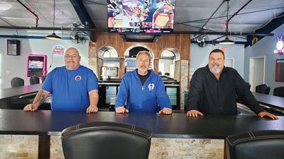 Sons of Amvets members, from left, John Roberts and Jeff Buckner and post commander Leonard Worley.