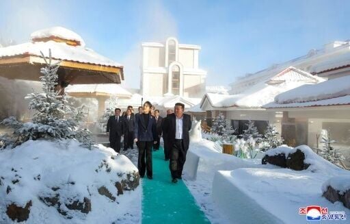 North Korean leader Kim Jong Un (R) and his daughter Ju Ae (L) inspecting the Milyong Hotel