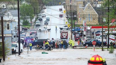 City officials battle floodwaters in April 2013. This photo was taken looking west on East Miller Street toward West Miller and Main streets in De Soto.