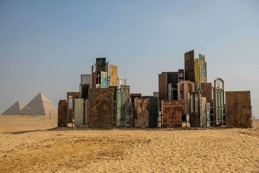 The art installation "Doors of Cairo" by artist Alexandre Farto, aka Vhils, formed part of the fifth edition of the "Forever is Now" art exhibition by Art d'Egypte at the Giza pyramids