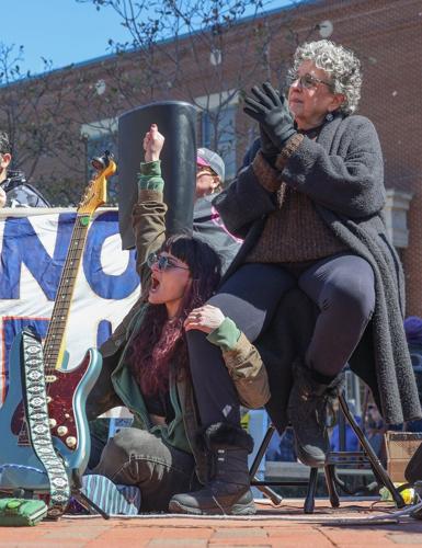 Sarah Meadows, left, and Jamie Meadows react to a speech