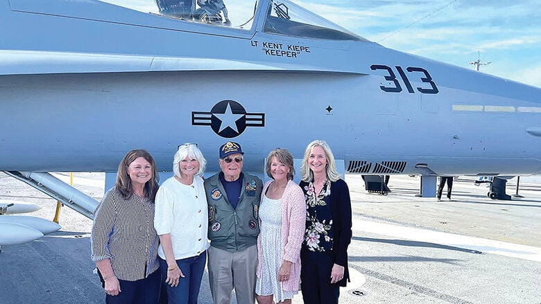 Lt. Kent Kiepe’s father and sisters in front of his plane at the dedication ceremony. From left, Kim Neel, Kelly Dallas, Glenn Kiepe, Kristi Landess and Kari Kopp.