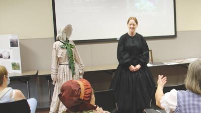 Ginger Brickey, Northwest Branch of the Jefferson County Library senior genealogy clerk, dressed as a woman in mouning while talking about Victorian mourning practices during Living History Day on Aug. 4 at the High Ridge library.