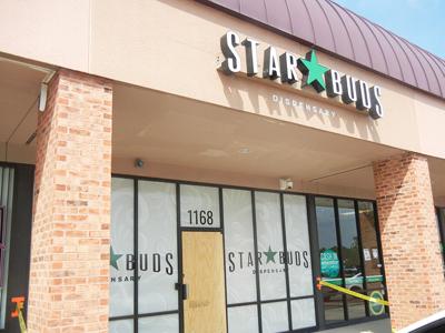 A glass door at the Star Buds Medical Marijuana Dispensary in Festus was boarded up after it was damaged when would-be thieves rammed it with cars to try to break in.