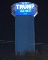 Trump, Vance sign projected onto Arnold water tower