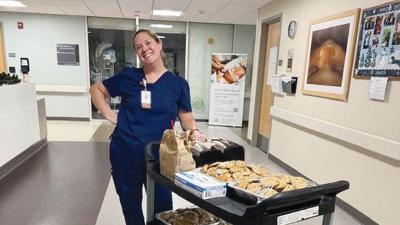Dr. Amanda Carroll delivers chocolate chip cookies she baked to Mercy Hospital Jefferson staff.