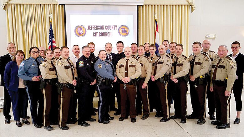 County officials with the 22 honorees at the CIT Officer Awards Banquet in March.
