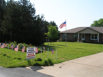 Flags honoring WWII shipmates at Hillsboro-area home