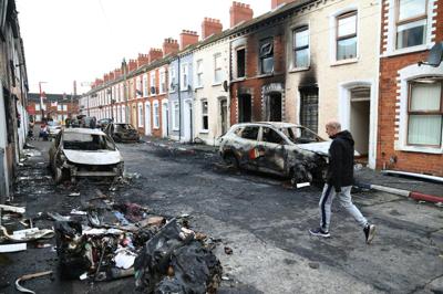 A man walks down a street in the aftermath of rioting in Belfast, Northern Ireland, on June 10, 2026.
 AP Photo/Peter Morrison