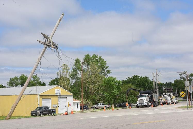 Following severe weather on Monday, a telephone pole leans