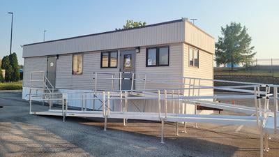 The United States Postal Services is serving customers out of this trailer in front of the building that will be the new Arnold Post Office, 2184 Michigan Ave.