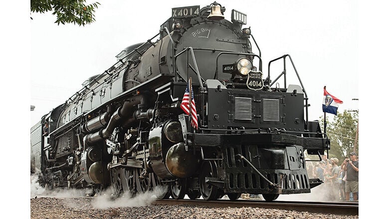The Union Pacific Big Boy No. 4014 begins to roll out of De Soto as an estimated 10,000 people, who traveled from across the country, watch the locomotive continue its journey south.