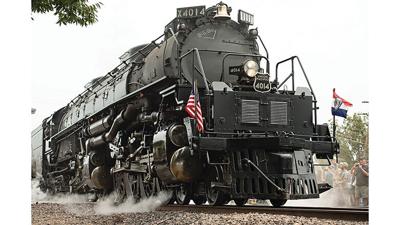 The Union Pacific Big Boy No. 4014 begins to roll out of De Soto as an estimated 10,000 people, who traveled from across the country, watch the locomotive continue its journey south.