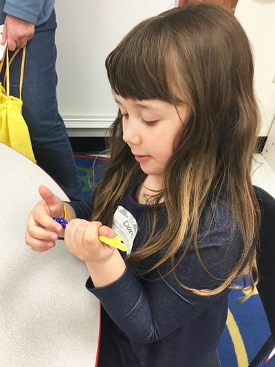 At Fox's Kindergarten Readiness Rally last year, Claire Amato practiced counting by stringing beads on a pipe cleaner at the math station.