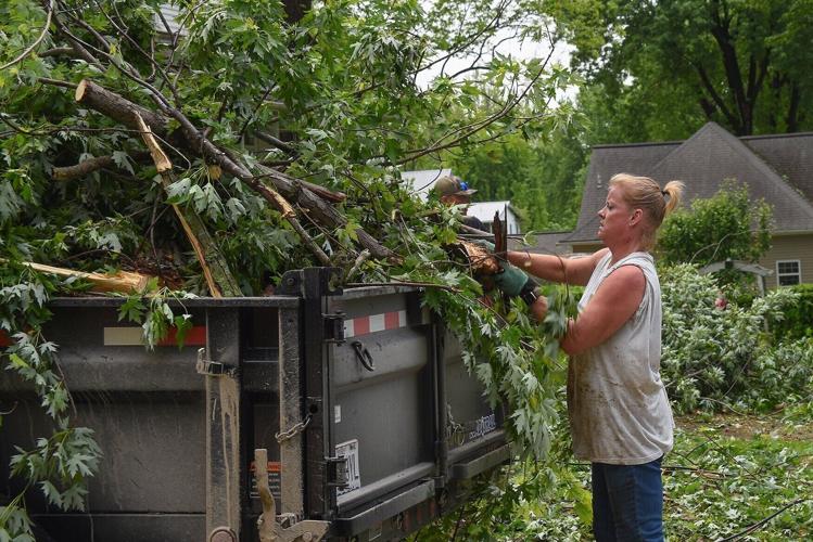 Tanya Monnig cleans up debris