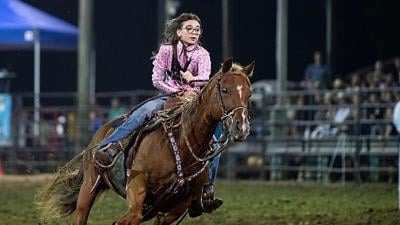 Maiya Green, 14, of Cedar Hill takes part in the barrel racing competition at the 2024 Jefferson County Rodeo.