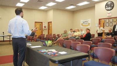 Andrew Struckhoff, president of PGAV Planners, the company putting together the plan, speaks at the meeting.