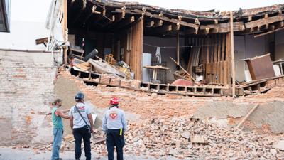 A wall in this building on South Main Street in De Soto collapsed Sunday, leading to the road being closed.