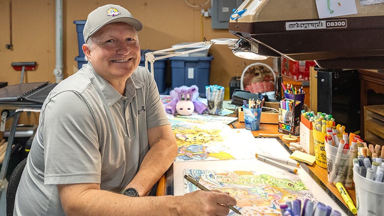 Scott Preston, 55, of Wildwood and his daughter, Lilly, 18, illustrated “The Traveling Hippo” activity book.