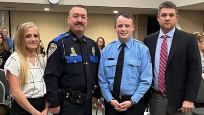 From left, Crystal City dispatcher Brittney Meyer, Police Officer Jack Montgomery and dispatcher Tyler Reed were honored for their work on a recent fraud case by Chief Chad Helms, right.