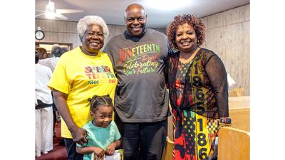 From left, Sharon Riney and her grandson, Kyson Mitchell, 3, of Crystal City, with Christopher and Roz Carter of St. Louis at the Juneteenth Sunday Service at Mount Olive Missionary Baptist Church.