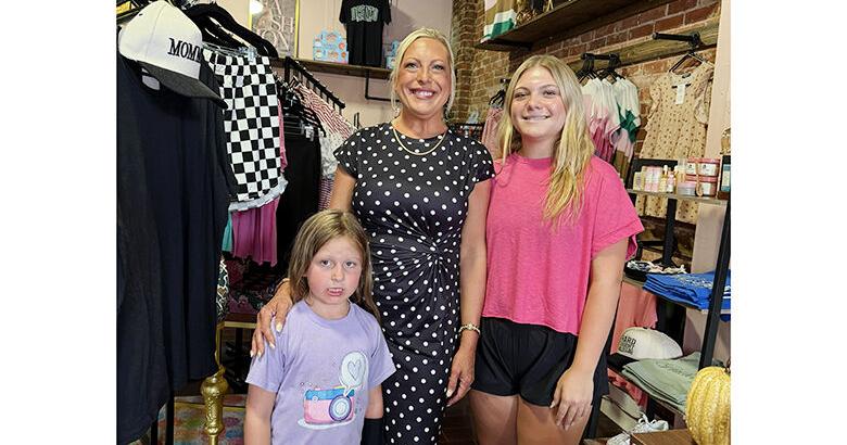 Mandy Rees, center, named her boutique after her daughters, Chaley, left, and Ava. Avaley Jane opened Aug. 8 at 221 E. Main St. in De Soto.